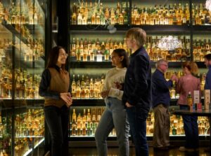 Customers in the whisky collection, enjoying their tour.