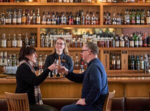 Couple enjoying a dram at the McIntyre Whisky Bar at the Scotch Whisky Experience.