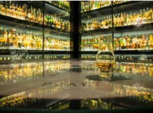 Whisky dram on the table within one of the World's Largest Collections of Scotch Whisky.