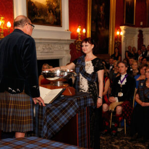 Lenky Whyles being presented with a quaich.