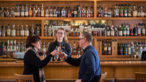 Customers at The McIntyre Bar at The Scotch Whisky Experience enjoying a dram.