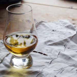 Whisky glass on tablecloth