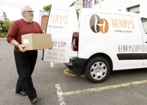 Henry's Coffee Company employee and company van