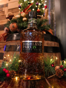 Bottle of Highland Park 15yo in festive scene
