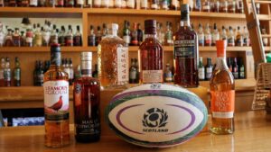 Whisky bottles and rugby ball