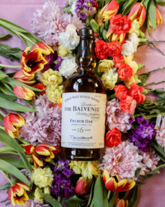Bottle of The Balvenie French Oak for March Whiskies of the Month with flowers in the background