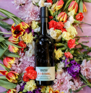 Bottle of Holyrood Arrival for March Whiskies of the Month, with flowers in background