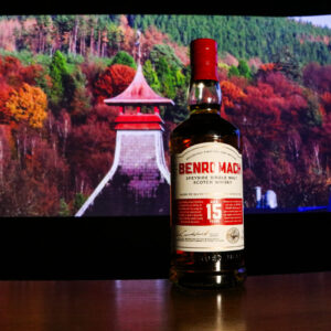 Whiskies of the month - Benromach 15yo with screen in background showing pagoda roof and Autumnal trees