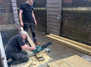 The maintenance team working on building the planters using the timber