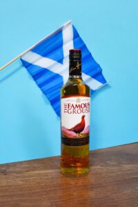 The Famous Grouse and a Scottish flag.