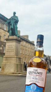 Bottle of Glenlivet in front of George IV statue near George Street, Edinburgh.