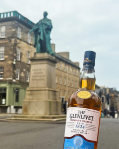 Bottle of Glenlivet in front of George IV statue near George Street, Edinburgh.