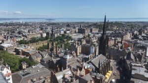 Image of Edinburgh's skyline with Princes Street in the background and the Firth of Fourth