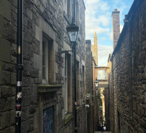 Image of Anchor's Close with an old fashioned lamp post and blue sky.