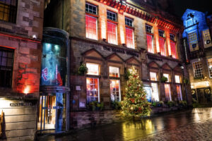 The Scotch Whisky Experience at Christmas with a Christmas Tree outside the building.